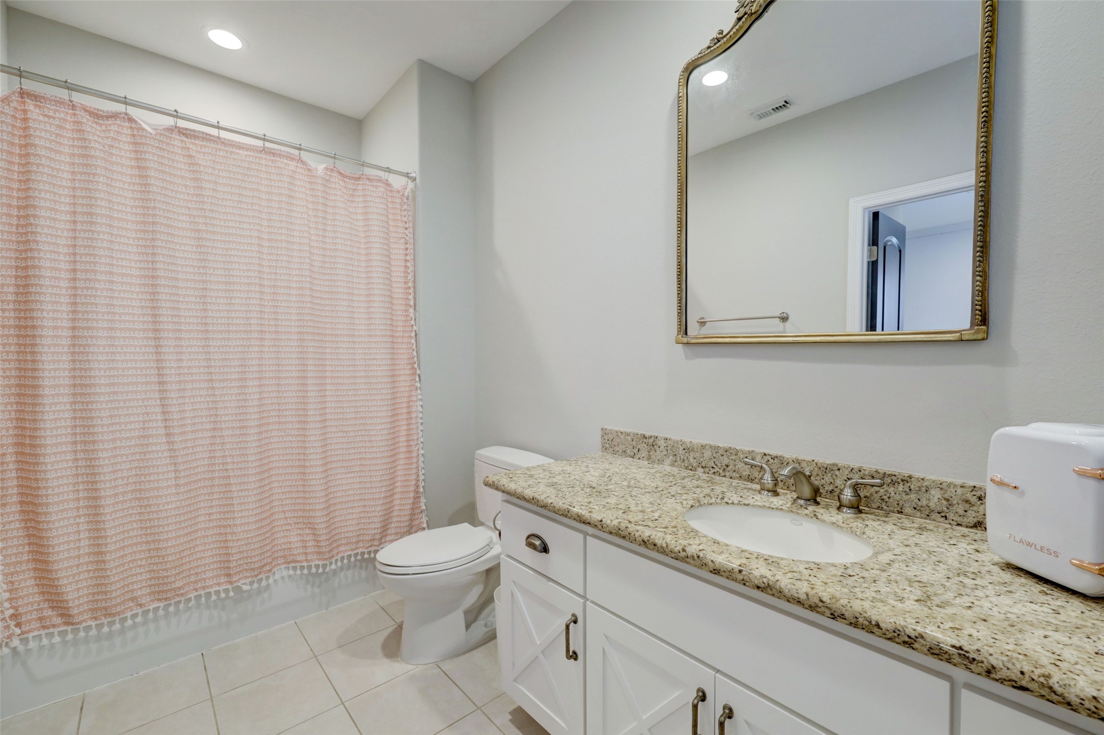 4004 Childress Street Houston, TX 77005 - Photo 24 of 35 a bathroom with a granite countertop sink and a mirror