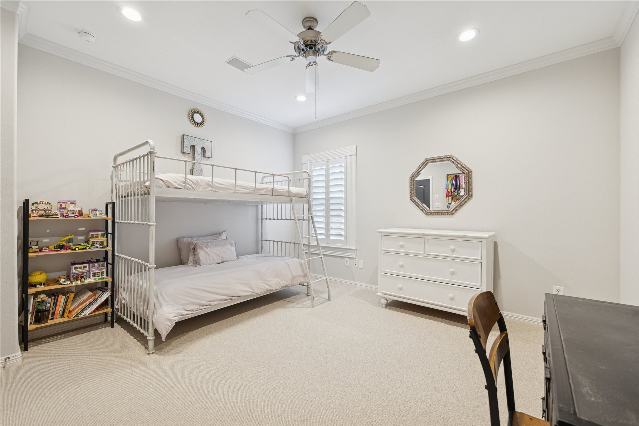 4004 Childress Street Houston, TX 77005 - Photo 25 of 35 a bedroom with a bed and a chandelier