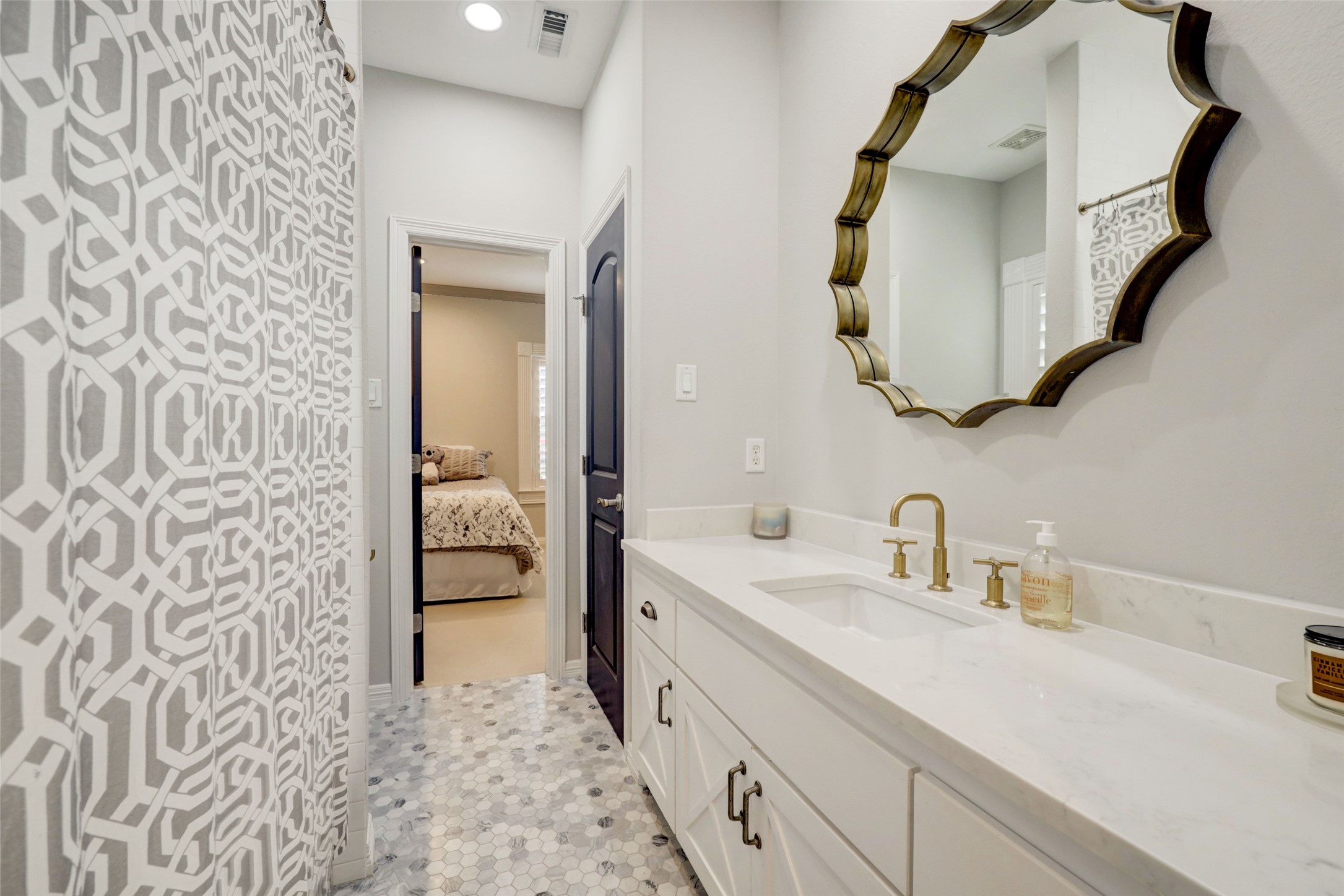 4004 Childress Street Houston, TX 77005 - Photo 26 of 35 a bathroom with a double vanity sink and mirror
