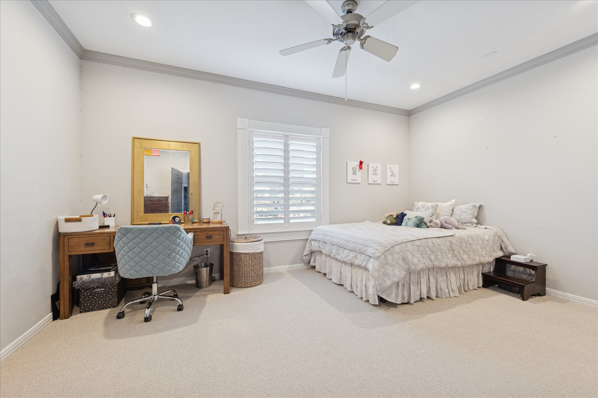 4004 Childress Street Houston, TX 77005 - Photo 27 of 35 a spacious bedroom with a bed a table and chair