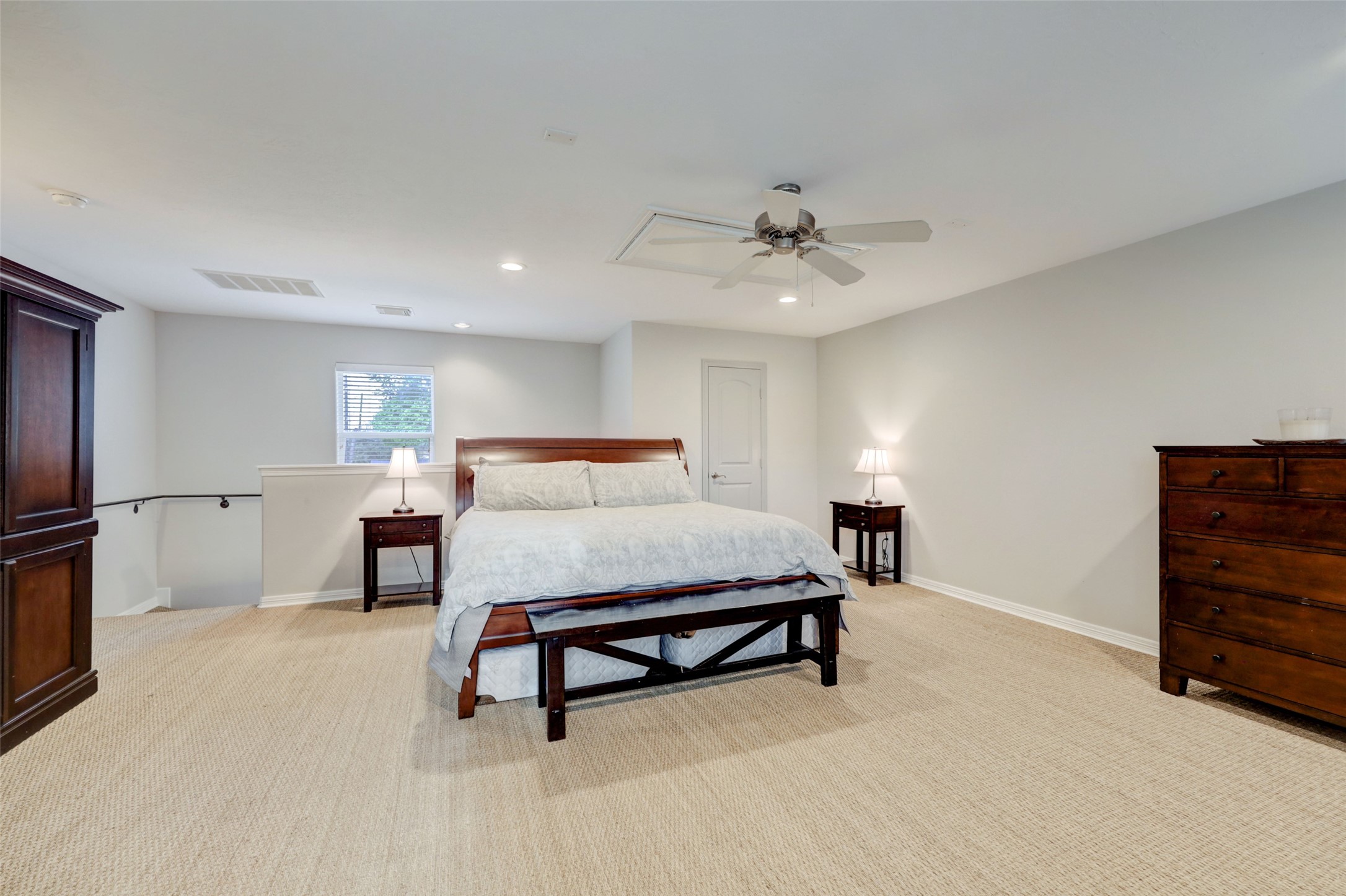 4004 Childress Street Houston, TX 77005 - Photo 28 of 35 a bedroom with furniture and a lamp