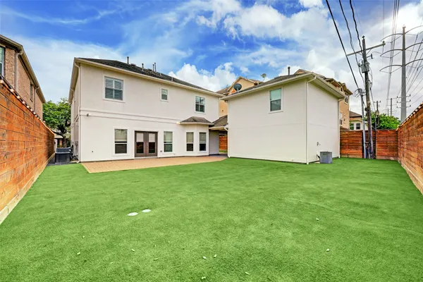 a view of a backyard with plants and a garden