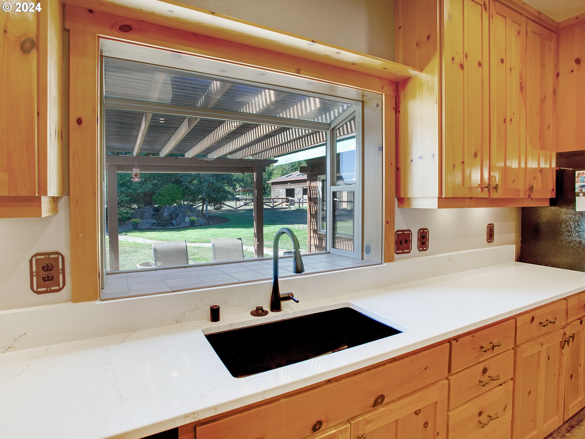 30410 Northwest 18th Place Ridgefield, WA 98642 - Photo 12 of 43 a kitchen with a sink and large window