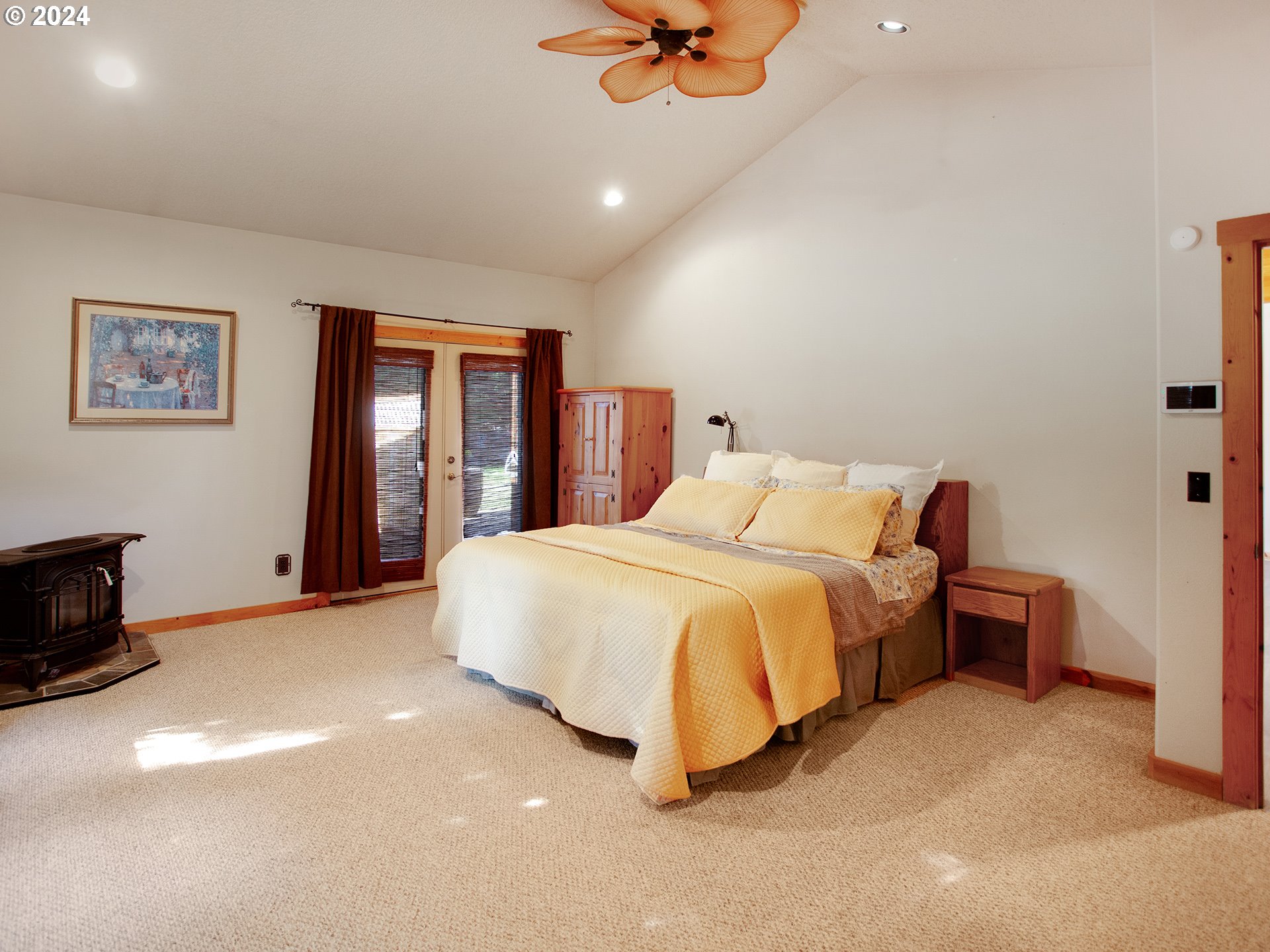 30410 Northwest 18th Place Ridgefield, WA 98642 - Photo 13 of 43 a bedroom with a bed and a chandelier