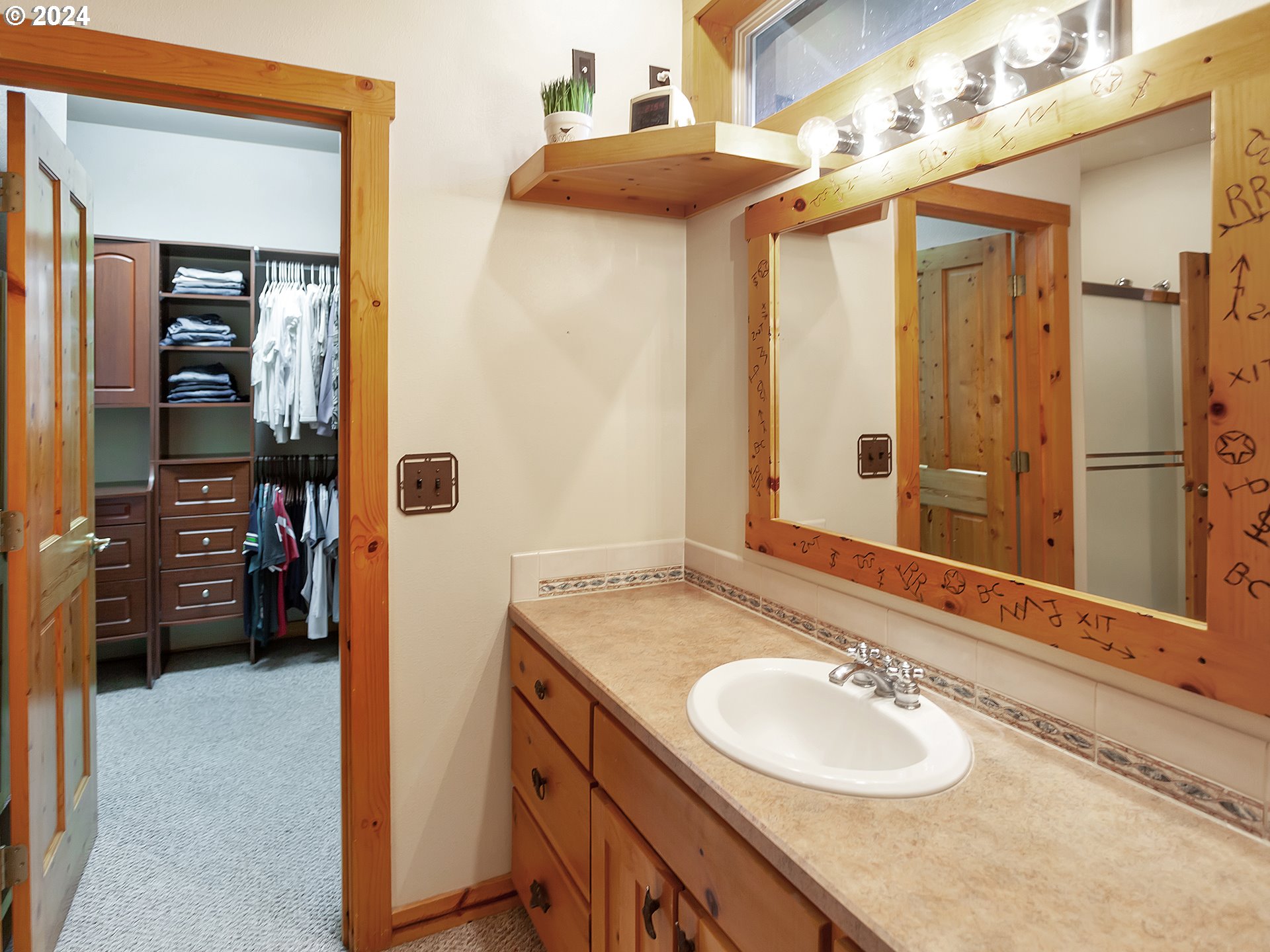 30410 Northwest 18th Place Ridgefield, WA 98642 - Photo 16 of 43 a bathroom with a granite countertop sink and a mirror