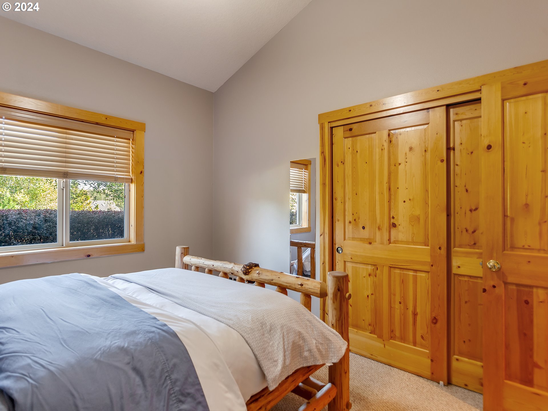 30410 Northwest 18th Place Ridgefield, WA 98642 - Photo 19 of 43 a bedroom with a bed and a window