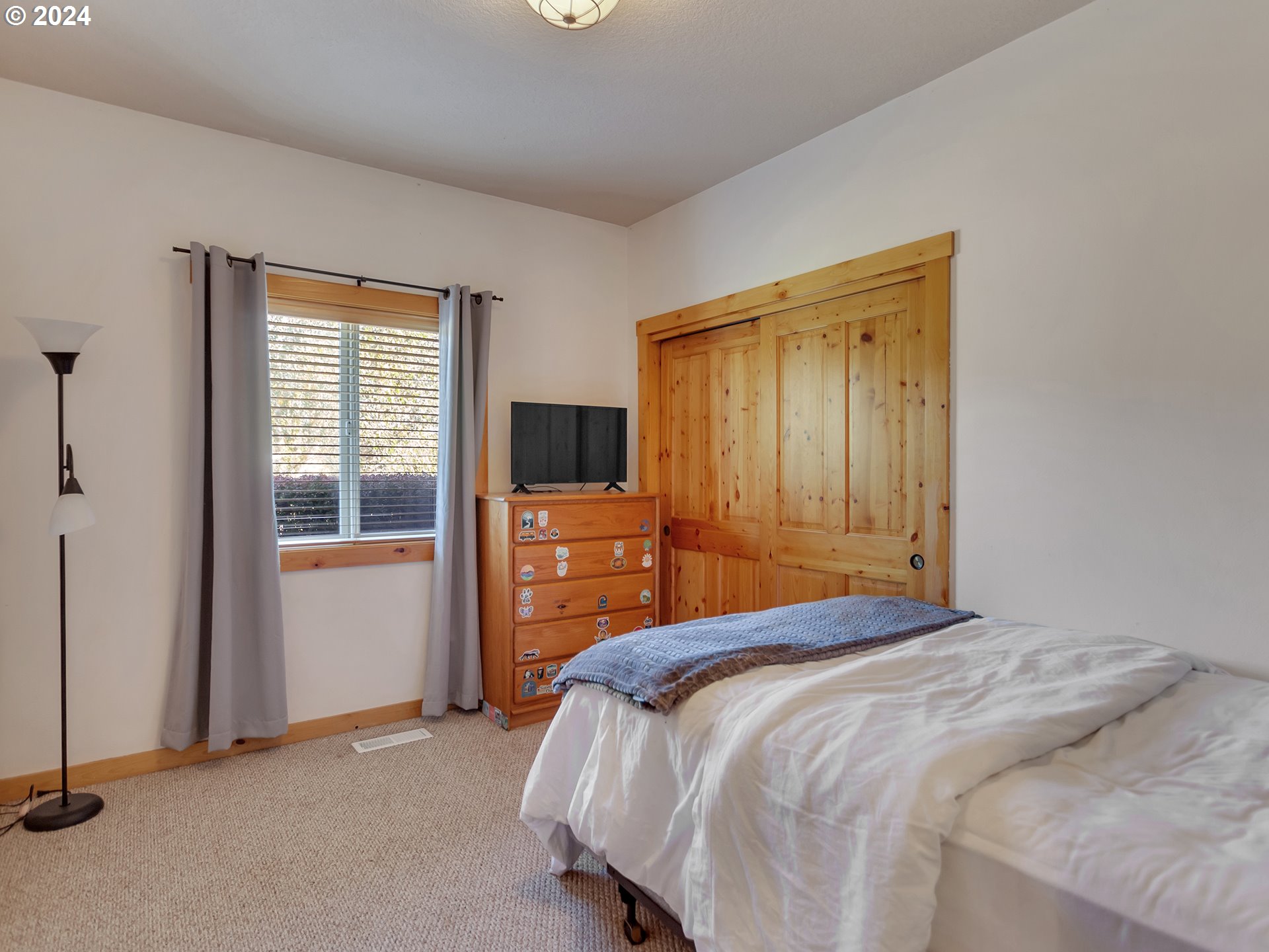 30410 Northwest 18th Place Ridgefield, WA 98642 - Photo 20 of 43 a bedroom with a bed and a television