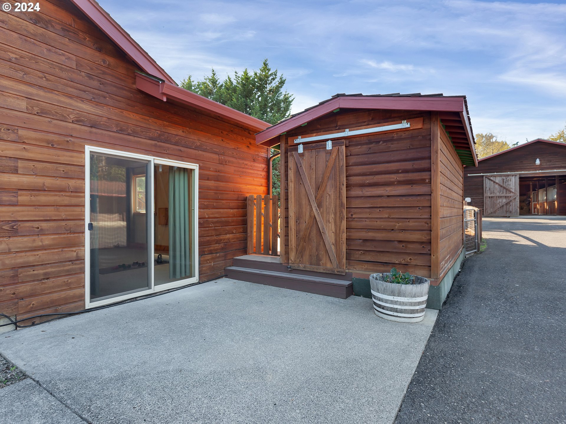 30410 Northwest 18th Place Ridgefield, WA 98642 - Photo 38 of 43 a view of backyard with cabin and wooden fencing