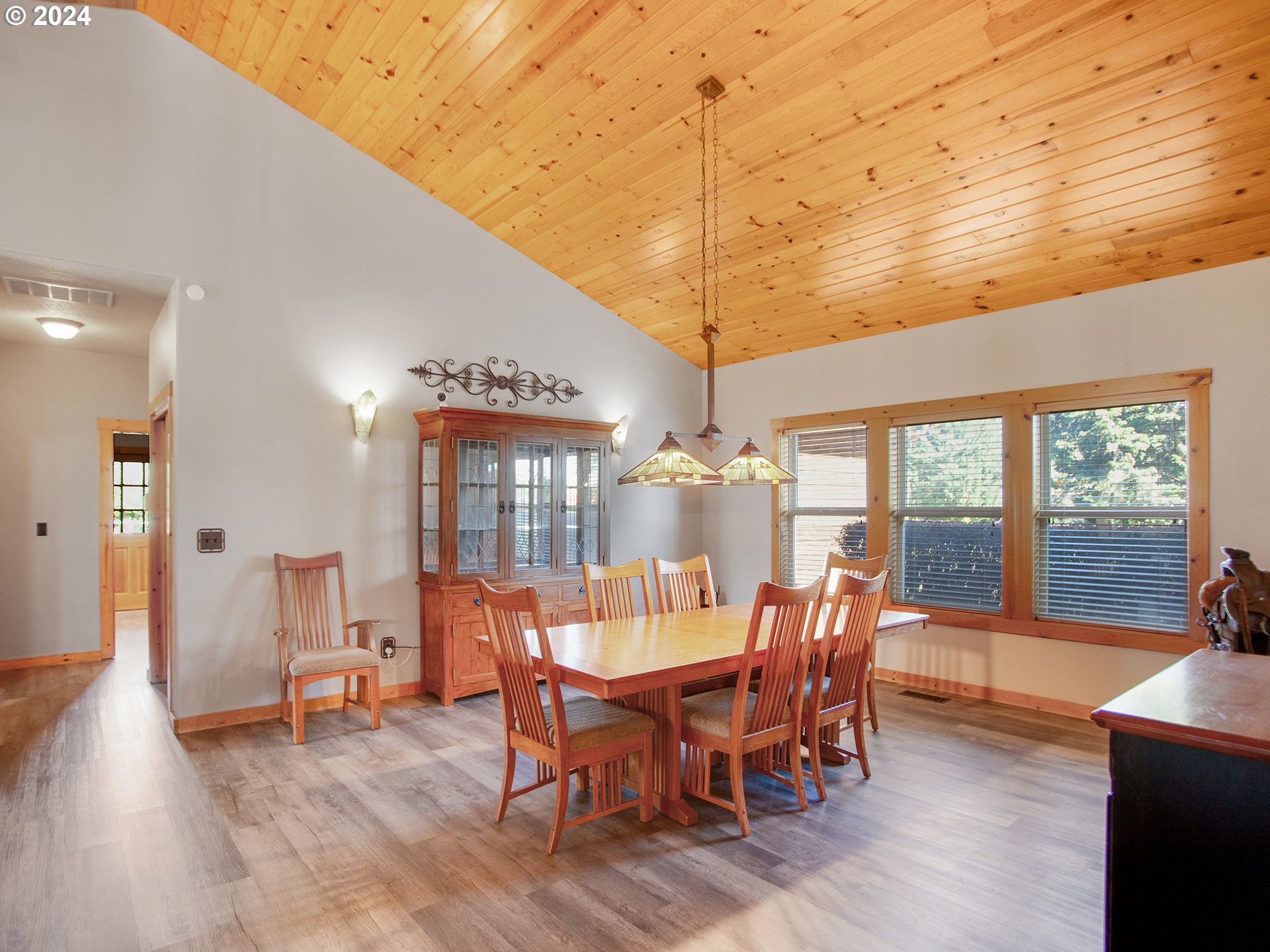 30410 Northwest 18th Place Ridgefield, WA 98642 - Photo 9 of 43 a view of a dining room with furniture window and wooden floor