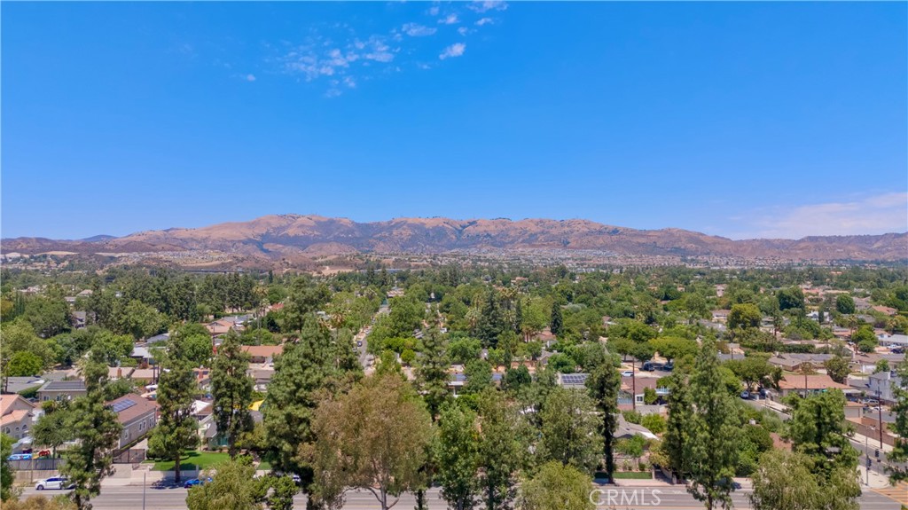 20722 Devonshire Street Chatsworth, CA 91311 - Photo 18 of 20 a view of a city with lush green forest