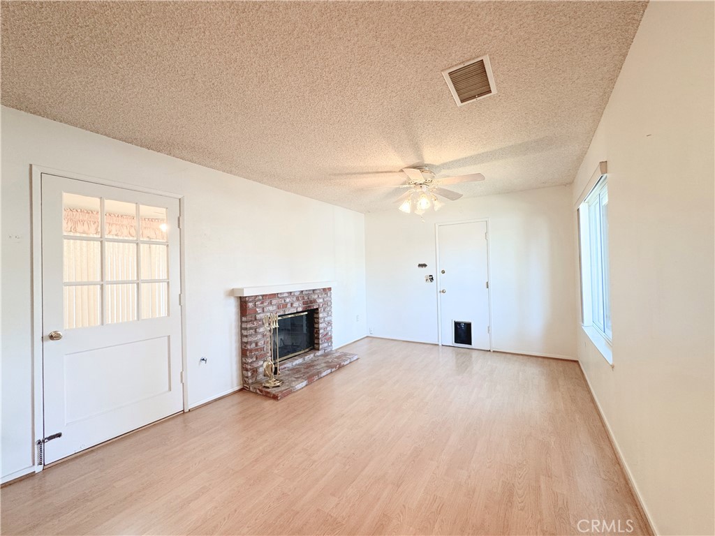 20722 Devonshire Street Chatsworth, CA 91311 - Photo 5 of 20 wooden floor in an empty room with a window