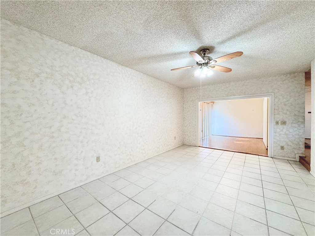 20722 Devonshire Street Chatsworth, CA 91311 - Photo 7 of 20 an empty room with windows and fan