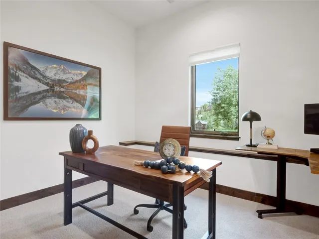 a view of a workspace with furniture