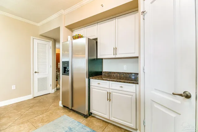 a dining room with furniture a large window and a dining table