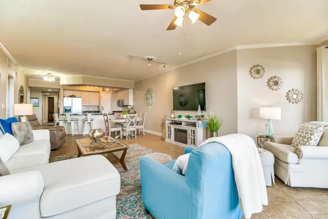 a bedroom with a bed a lamp and a large window