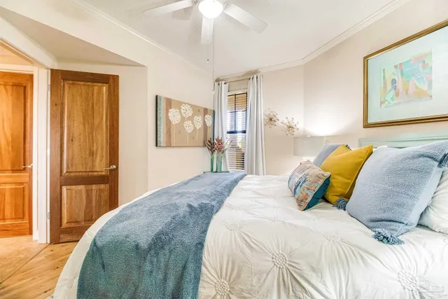 a bedroom with a bed and a dresser