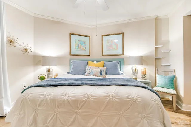 a bedroom with a large bed a flat tv screen and a closet