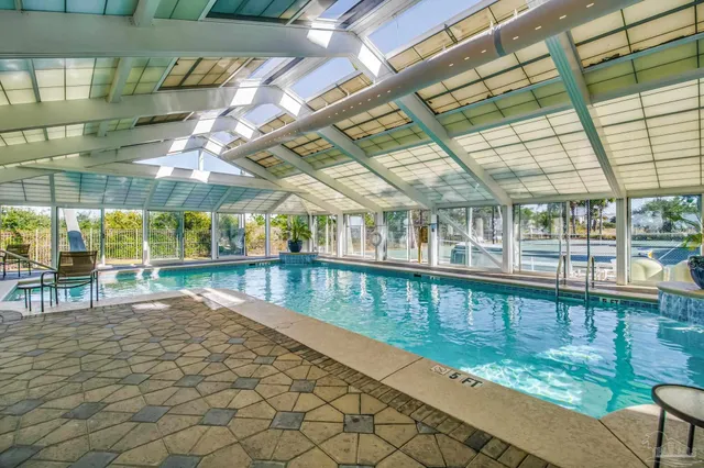 a view of a swimming pool and lounge chair