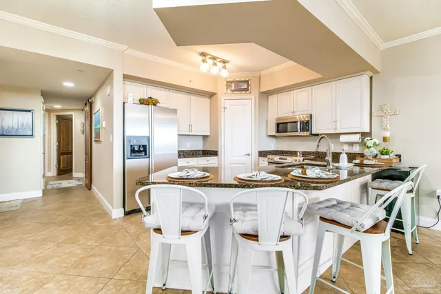a dining room with furniture and chandelier