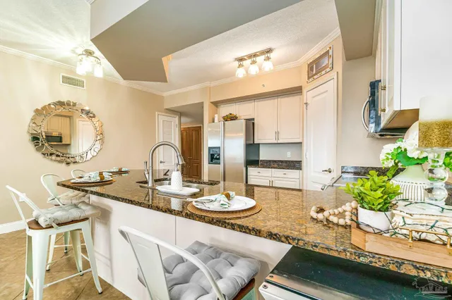 a kitchen with a sink stove and cabinets