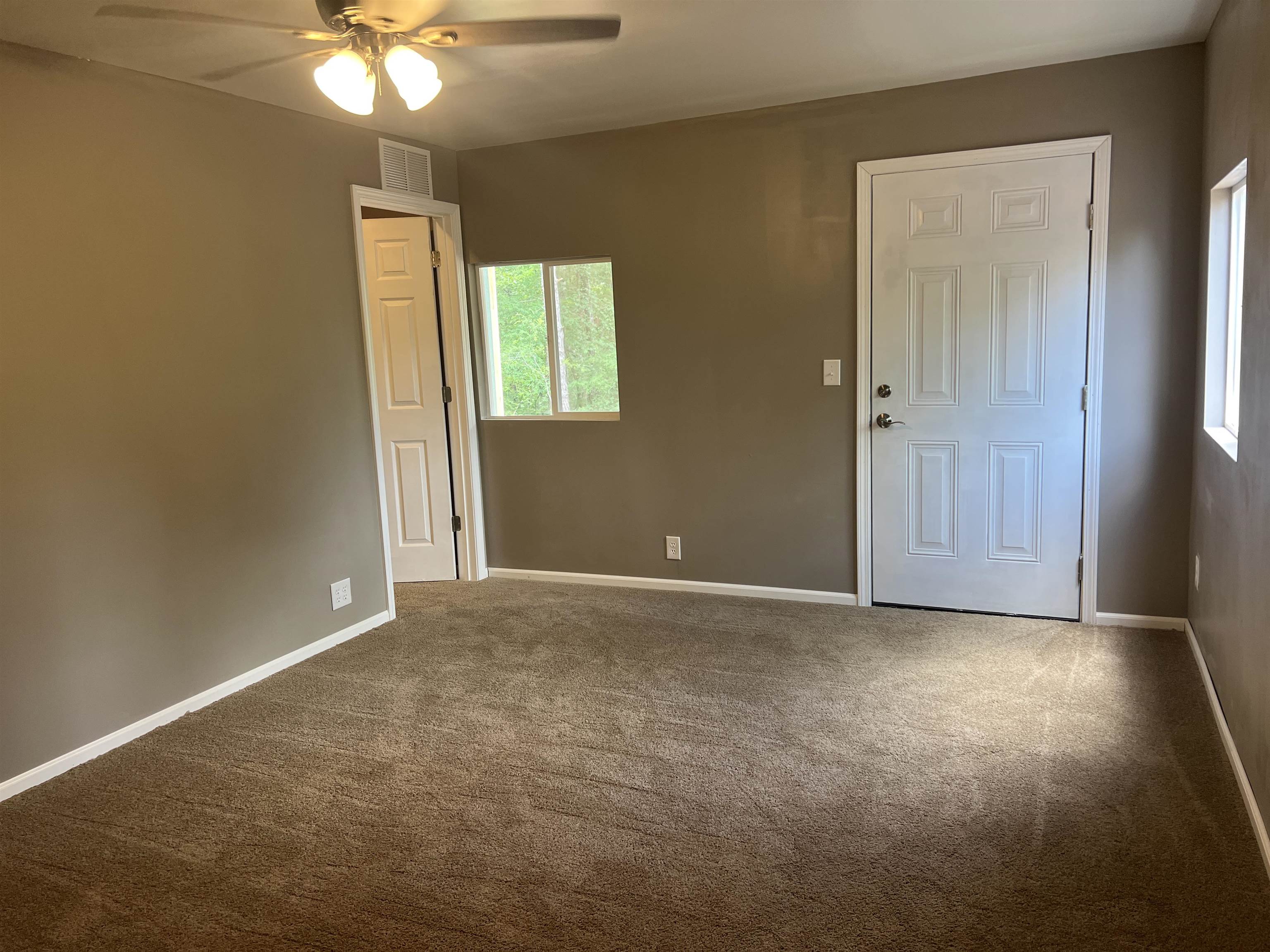 1525 Bullman Road Finger, TN 38334 - Photo 17 of 24 an empty room with windows and fan