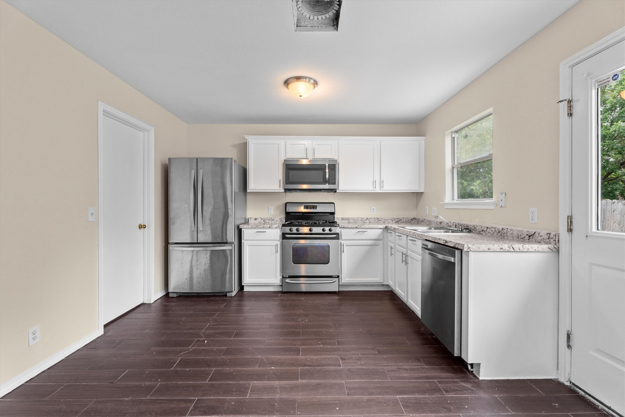 172 Discovery Kyle, TX 78640 - Photo 4 of 21 Open kitchen with plenty of counter space and an easy setup for everyday cooking and dining.