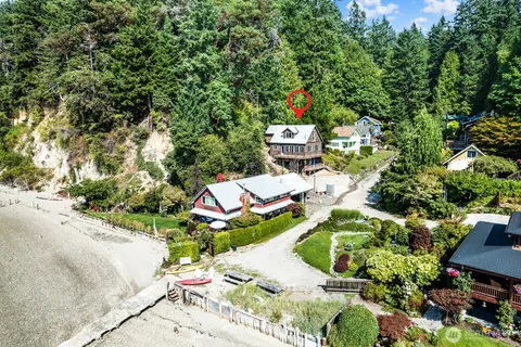 a aerial view of a house with a yard