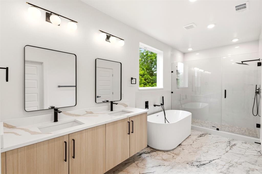 413 North Patton Avenue Dallas, TX 75203 - Photo 10 of 21 a bathroom with a double vanity sink a mirror and a