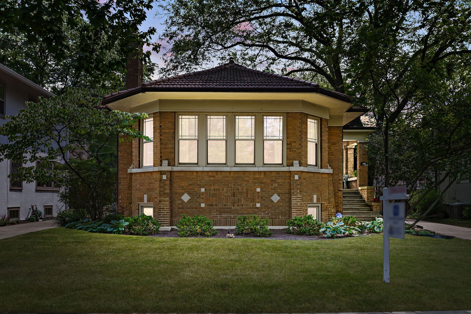 106 4th Street Wilmette, IL 60091 - Photo 20 of 20 a front view of a house with garden