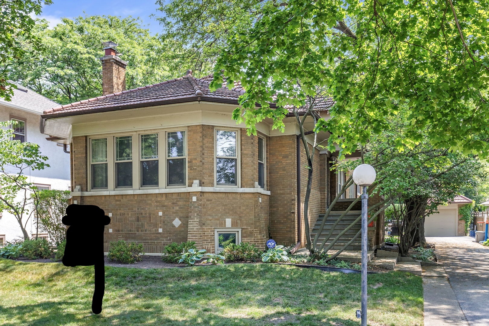 106 4th Street Wilmette, IL 60091 - Photo 2 of 20 a view of a house with backyard and a tree