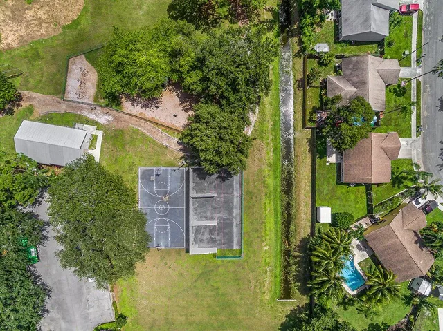 an aerial view of a house with a garden