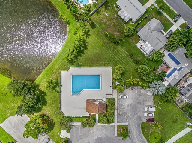an aerial view of a house with a garden and yard