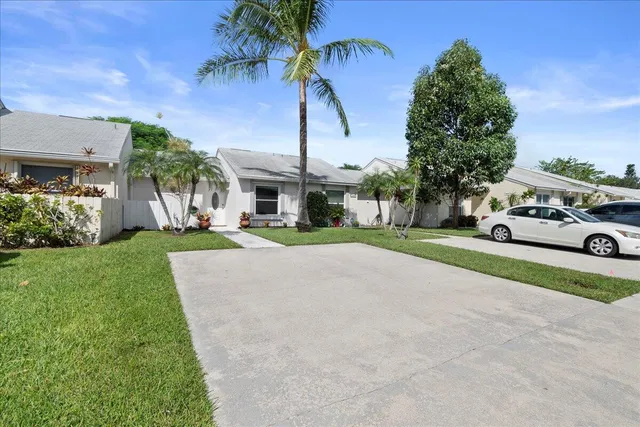 a house with a garden and trees
