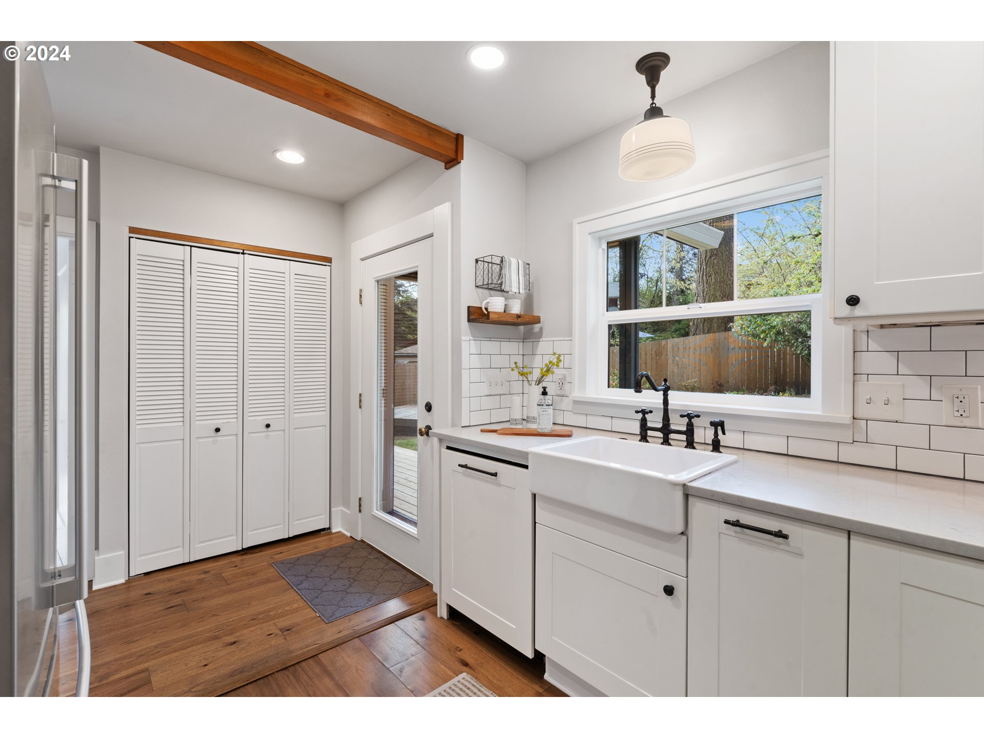 4016 Southwest Cullen Boulevard Portland, OR 97221 - Photo 13 of 41 a kitchen with a sink cabinets and window