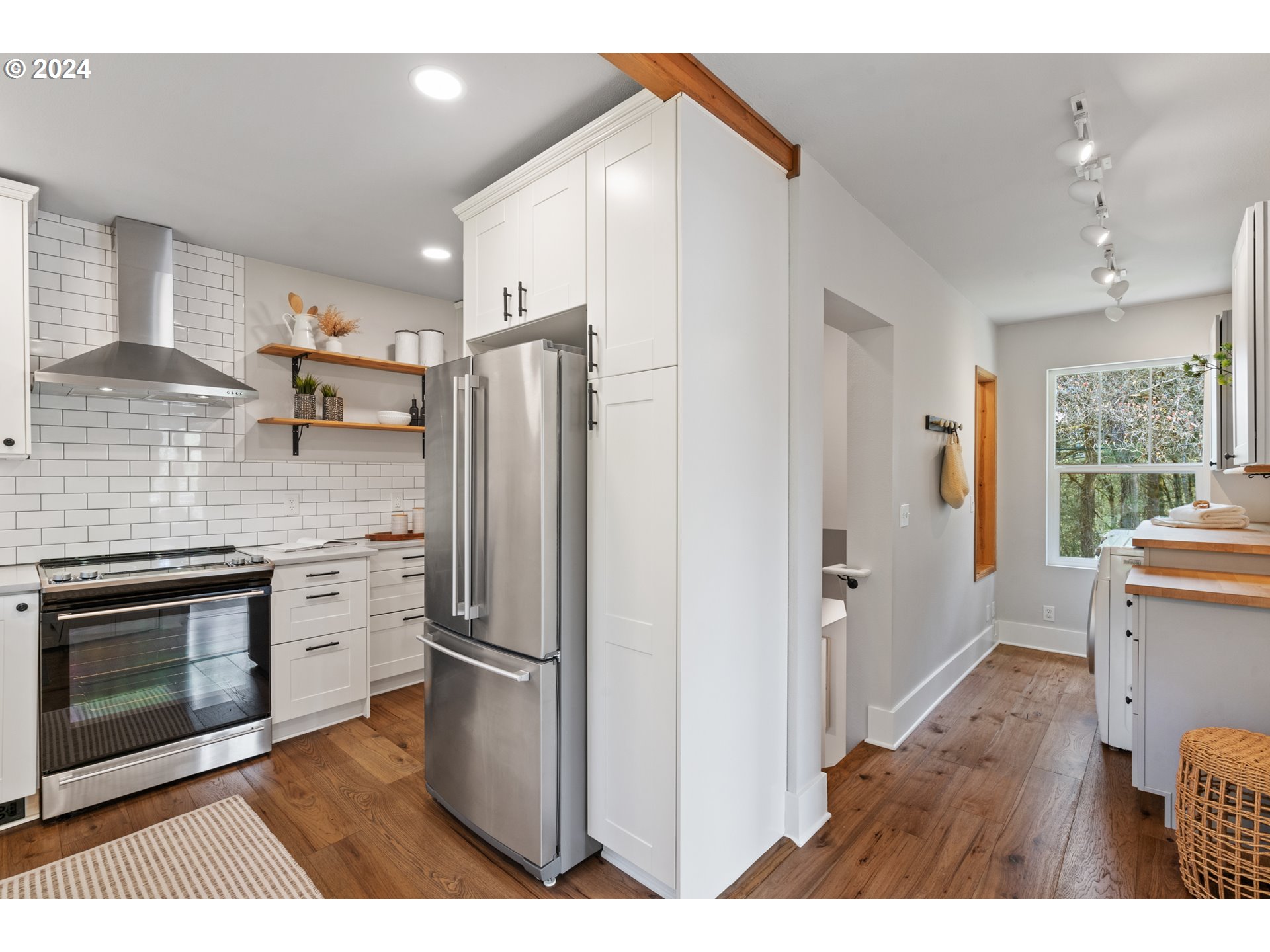 4016 Southwest Cullen Boulevard Portland, OR 97221 - Photo 14 of 41 a kitchen with stainless steel appliances a refrigerator sink and stove