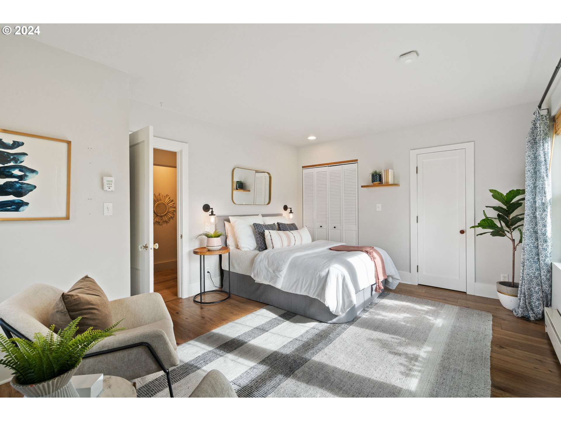 4016 Southwest Cullen Boulevard Portland, OR 97221 - Photo 17 of 41 a bedroom with a bed and window