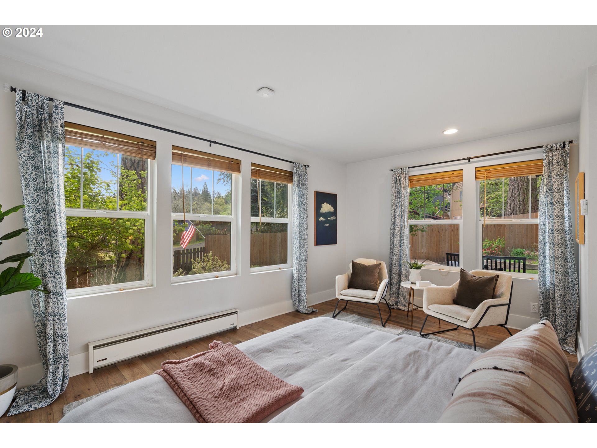 4016 Southwest Cullen Boulevard Portland, OR 97221 - Photo 18 of 41 a living room with furniture and floor to ceiling windows