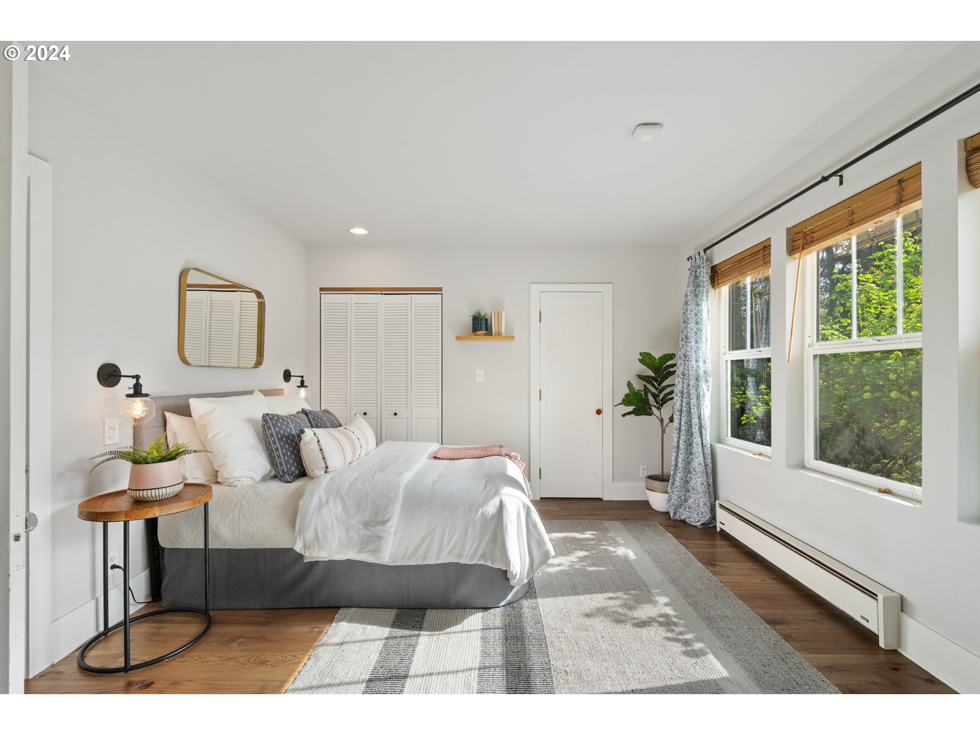 4016 Southwest Cullen Boulevard Portland, OR 97221 - Photo 19 of 41 a bedroom with a large bed and a window