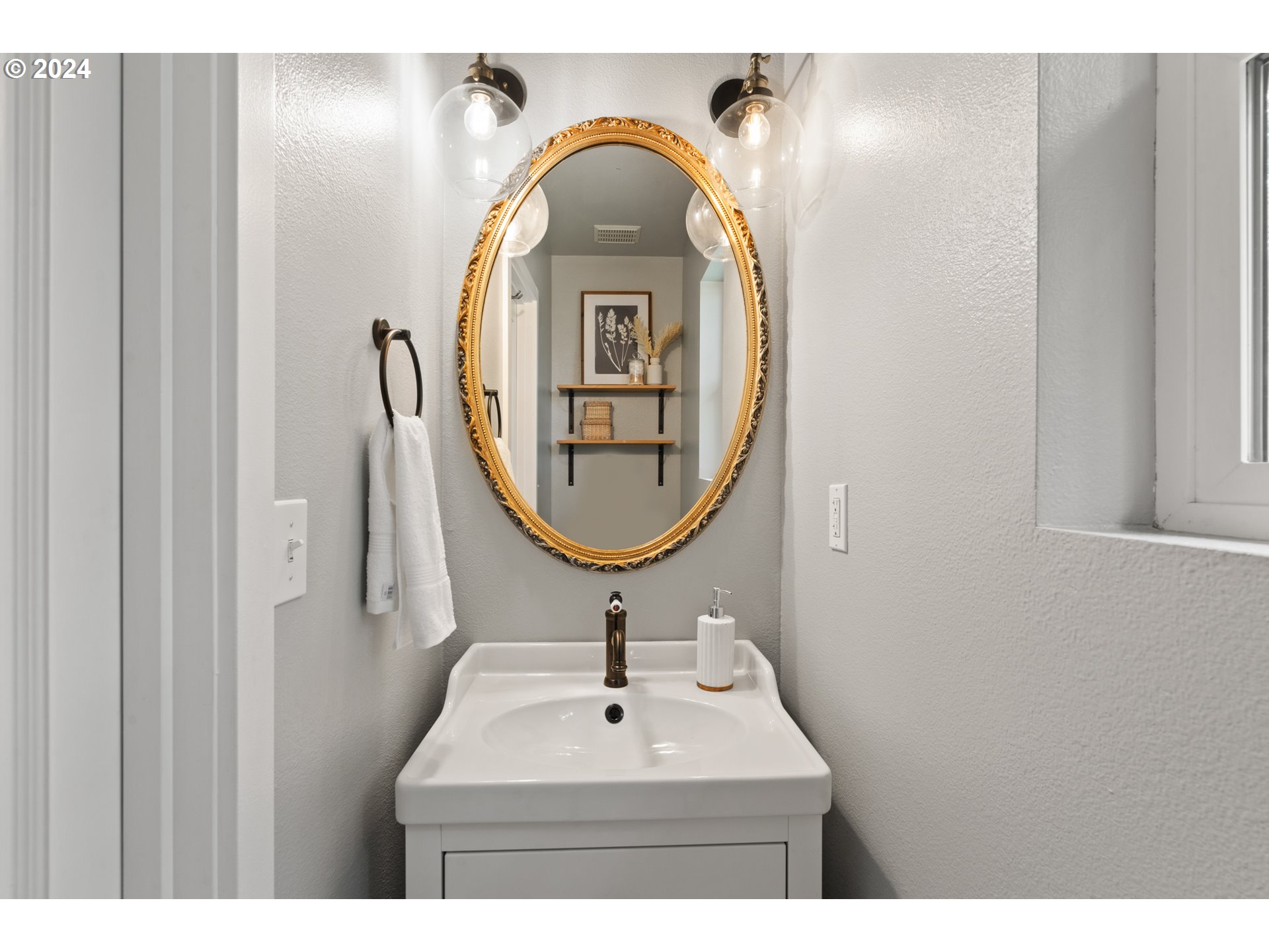 4016 Southwest Cullen Boulevard Portland, OR 97221 - Photo 20 of 41 a bathroom with a sink and a mirror