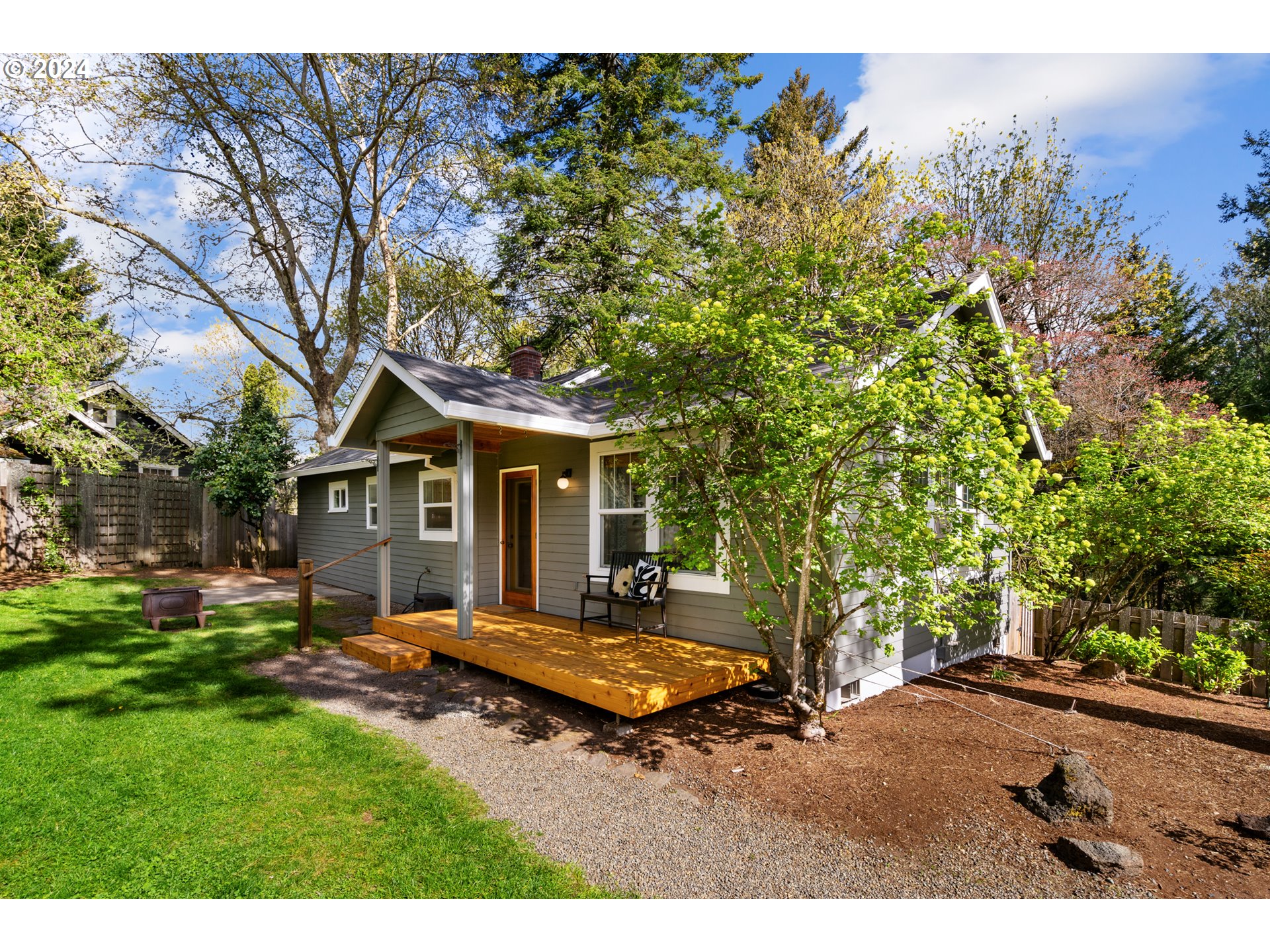 4016 Southwest Cullen Boulevard Portland, OR 97221 - Photo 2 of 41 a view of a house with backyard and a tree