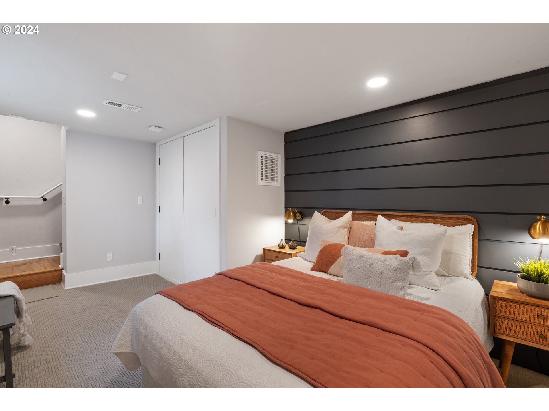 4016 Southwest Cullen Boulevard Portland, OR 97221 - Photo 21 of 41 a bedroom with a bed and a night stand