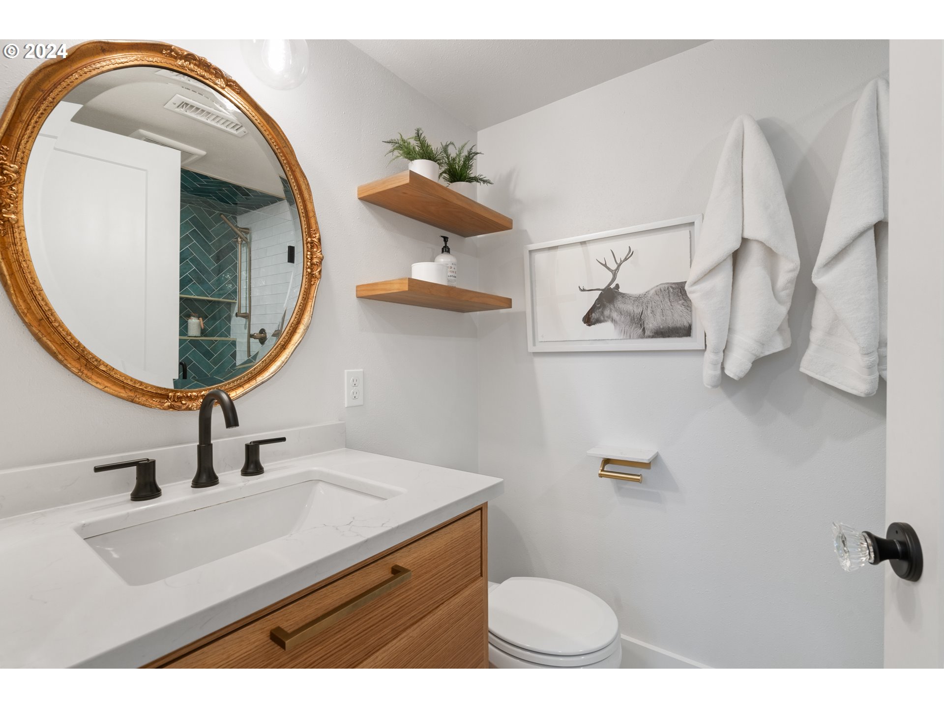 4016 Southwest Cullen Boulevard Portland, OR 97221 - Photo 24 of 41 a bathroom with a sink mirror and vanity