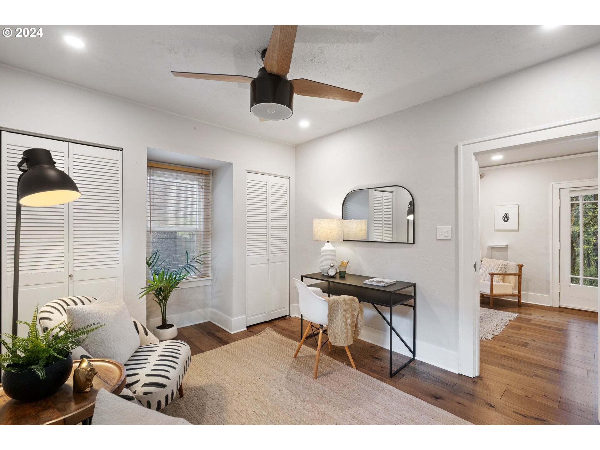 4016 Southwest Cullen Boulevard Portland, OR 97221 - Photo 26 of 41 a living room with furniture and a wooden floor