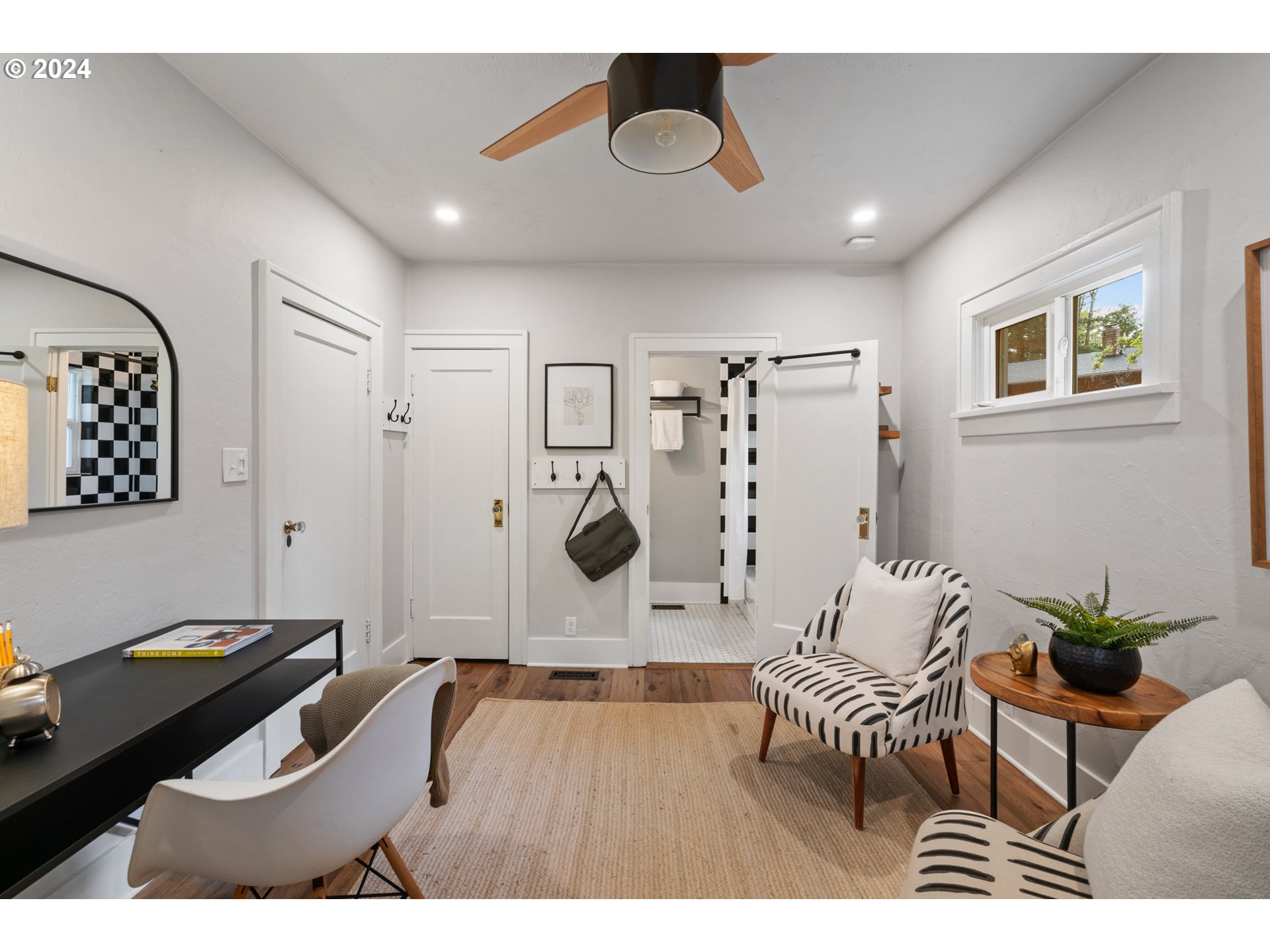 4016 Southwest Cullen Boulevard Portland, OR 97221 - Photo 27 of 41 a living room with furniture and wooden floor