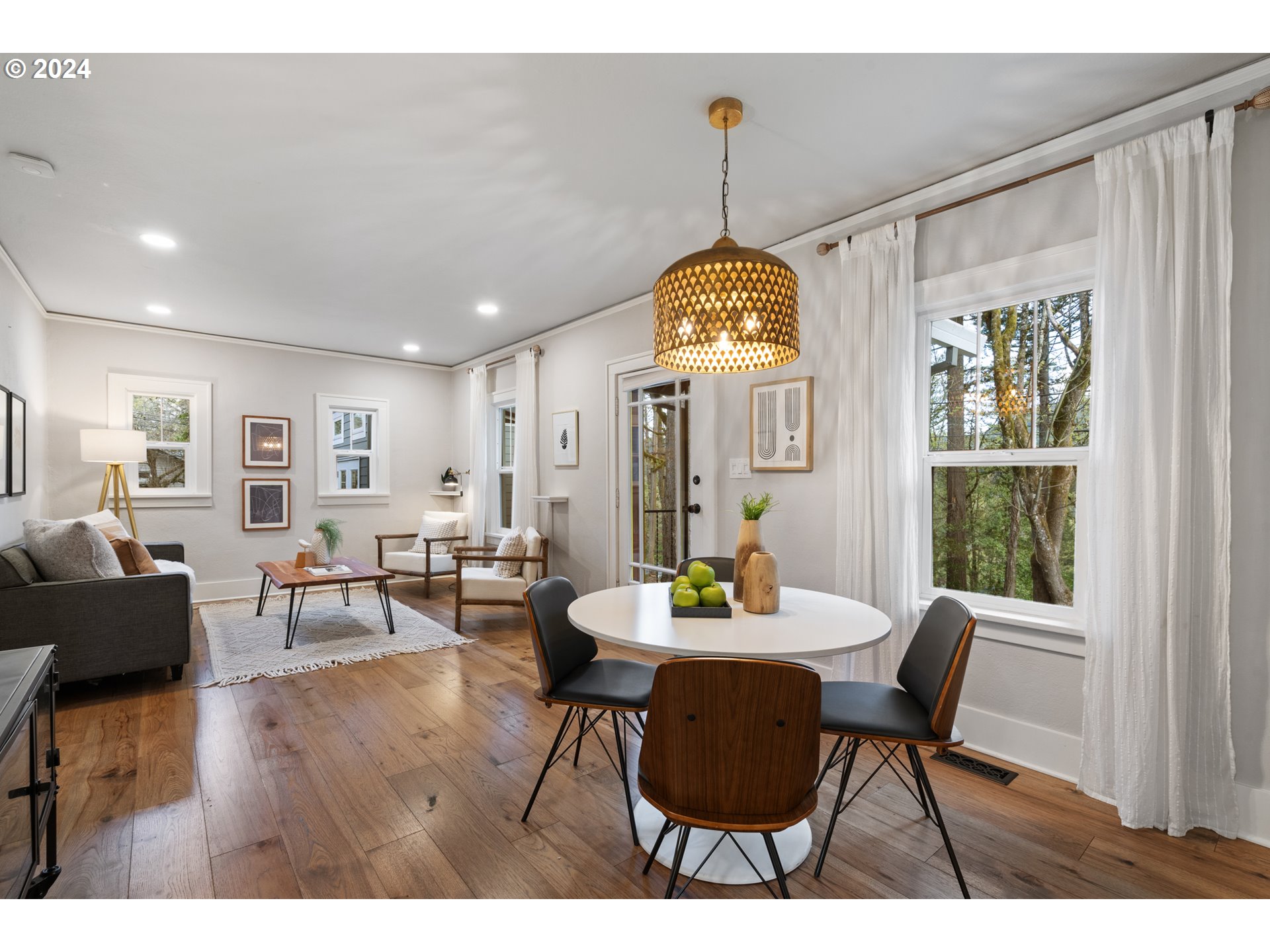 4016 Southwest Cullen Boulevard Portland, OR 97221 - Photo 3 of 41 a view of a dining room with furniture window and wooden floor