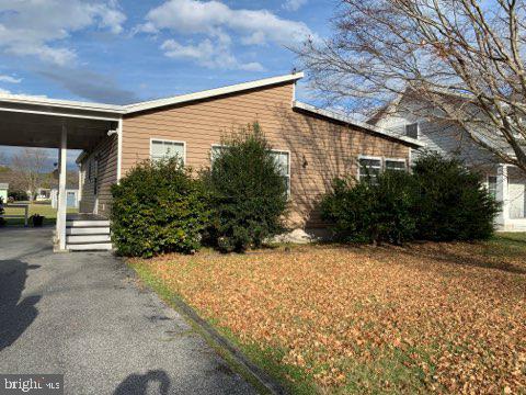 607 Collins Street Bethany Beach, DE 19930 - Photo 2 of 13 a view of a house with a snow in the yard