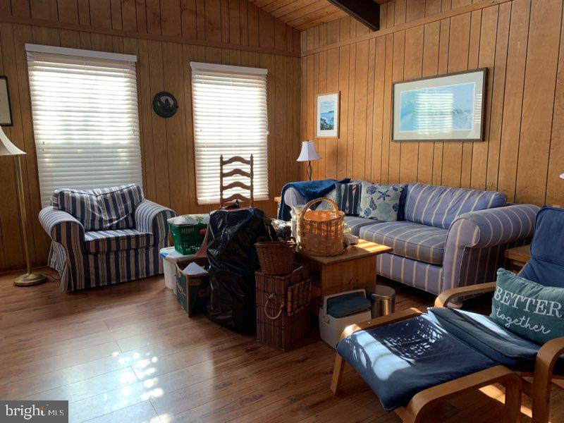 607 Collins Street Bethany Beach, DE 19930 - Photo 3 of 13 a living room with furniture and a window