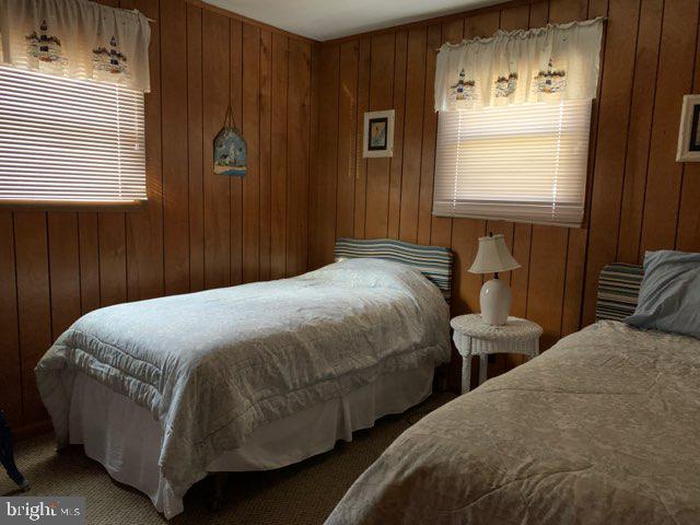 607 Collins Street Bethany Beach, DE 19930 - Photo 10 of 13 a bedroom with two beds and a window
