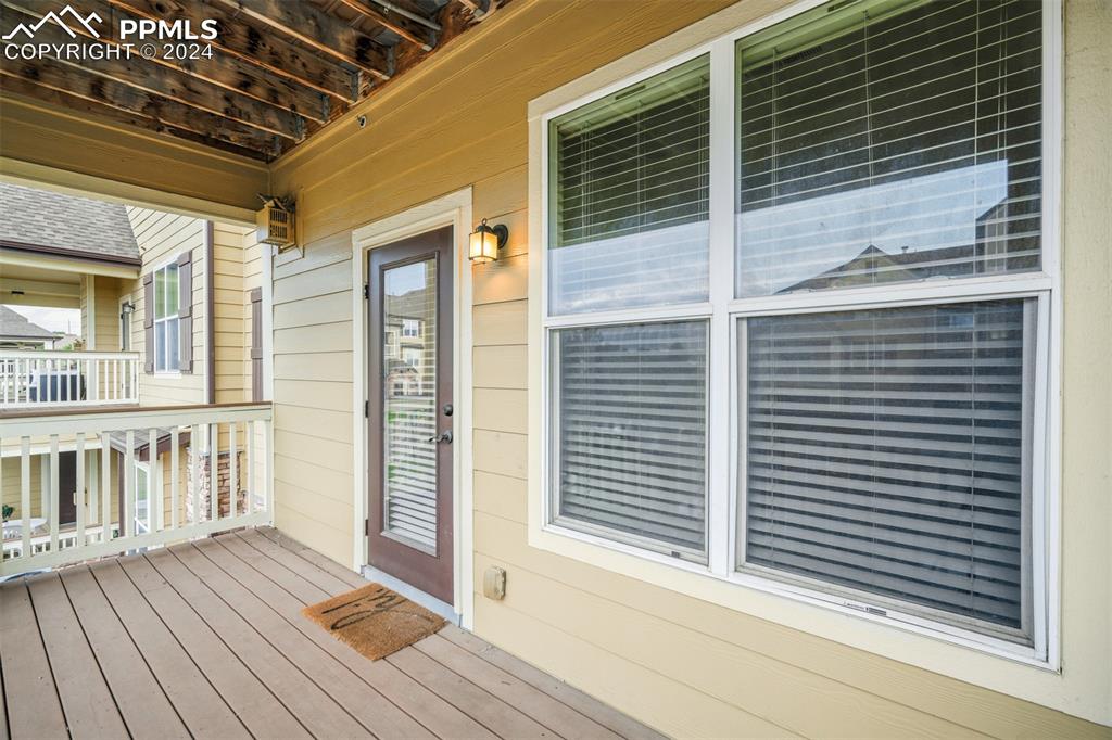 5353 Palomino Ranch Point, Unit 202 Colorado Springs, CO 80922 - Photo 12 of 34 a view of a balcony with wooden floor