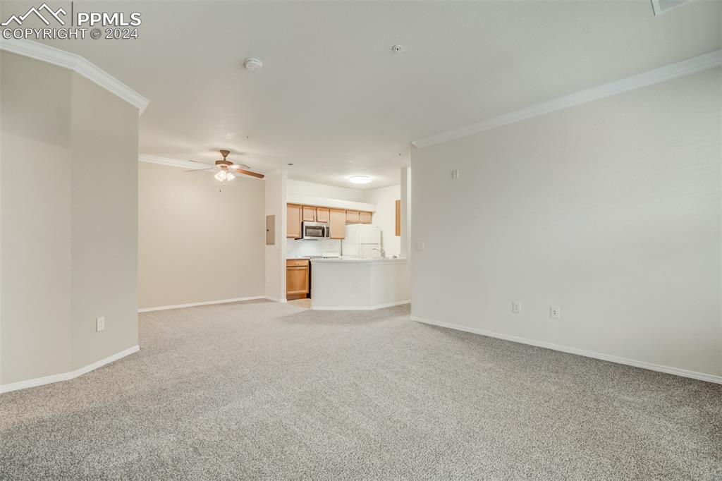 5353 Palomino Ranch Point, Unit 202 Colorado Springs, CO 80922 - Photo 15 of 34 a view of empty room with wooden floor